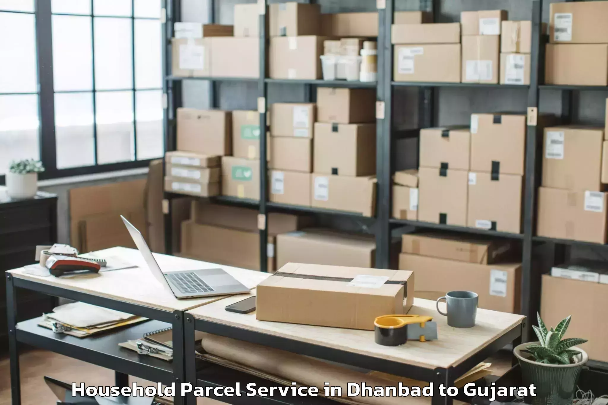 Book Dhanbad to Uchchhal Household Parcel Online